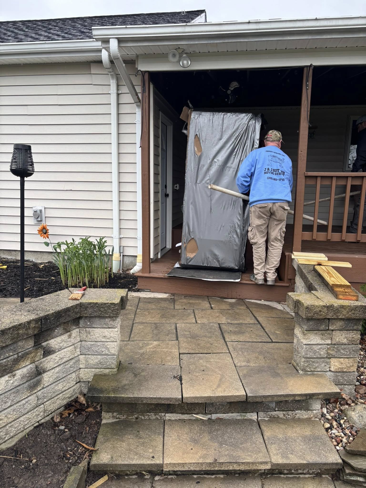 Hot tub being carefully moved to its new location