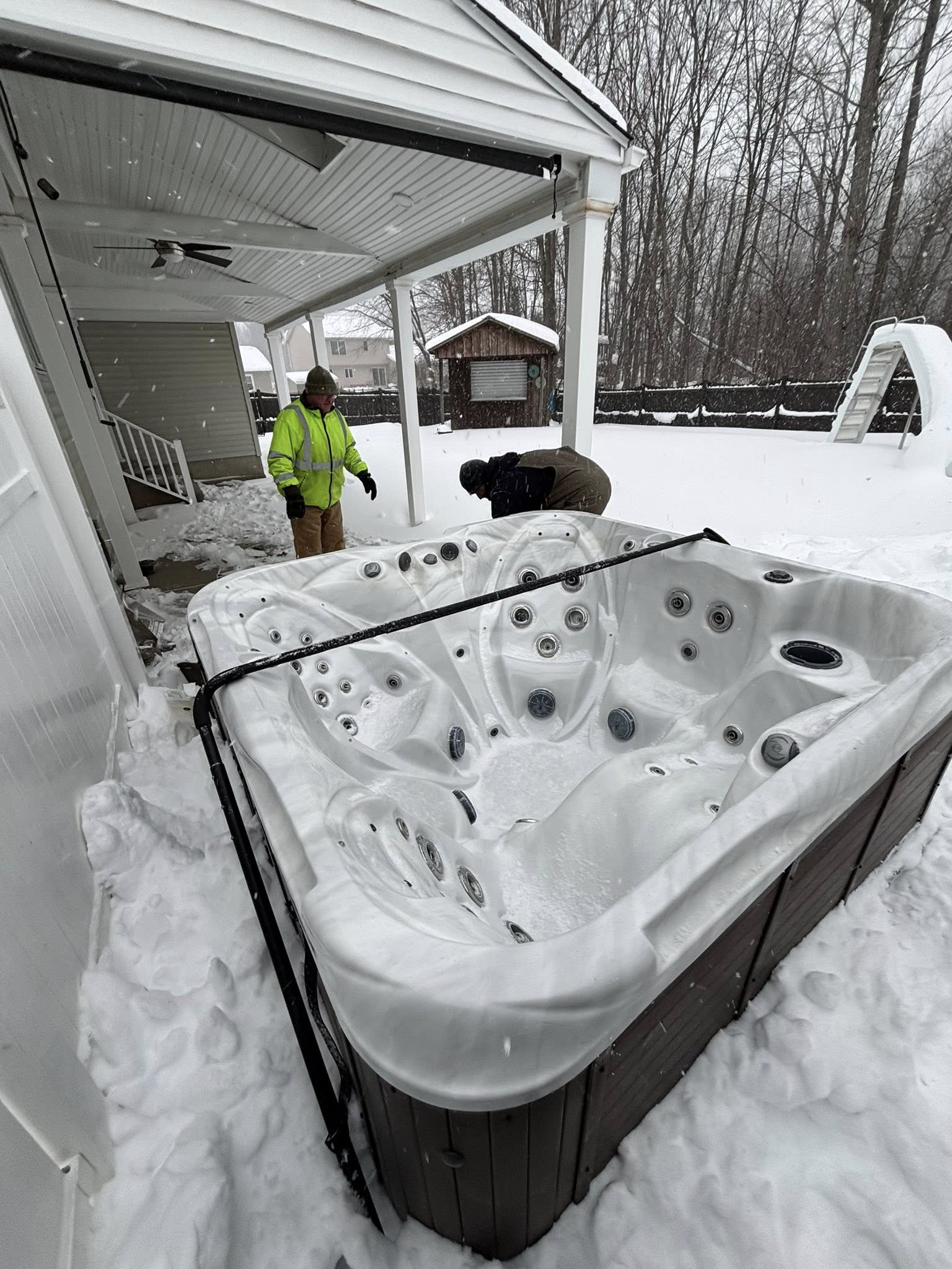 Hot tub move in winter conditions — we work year-round