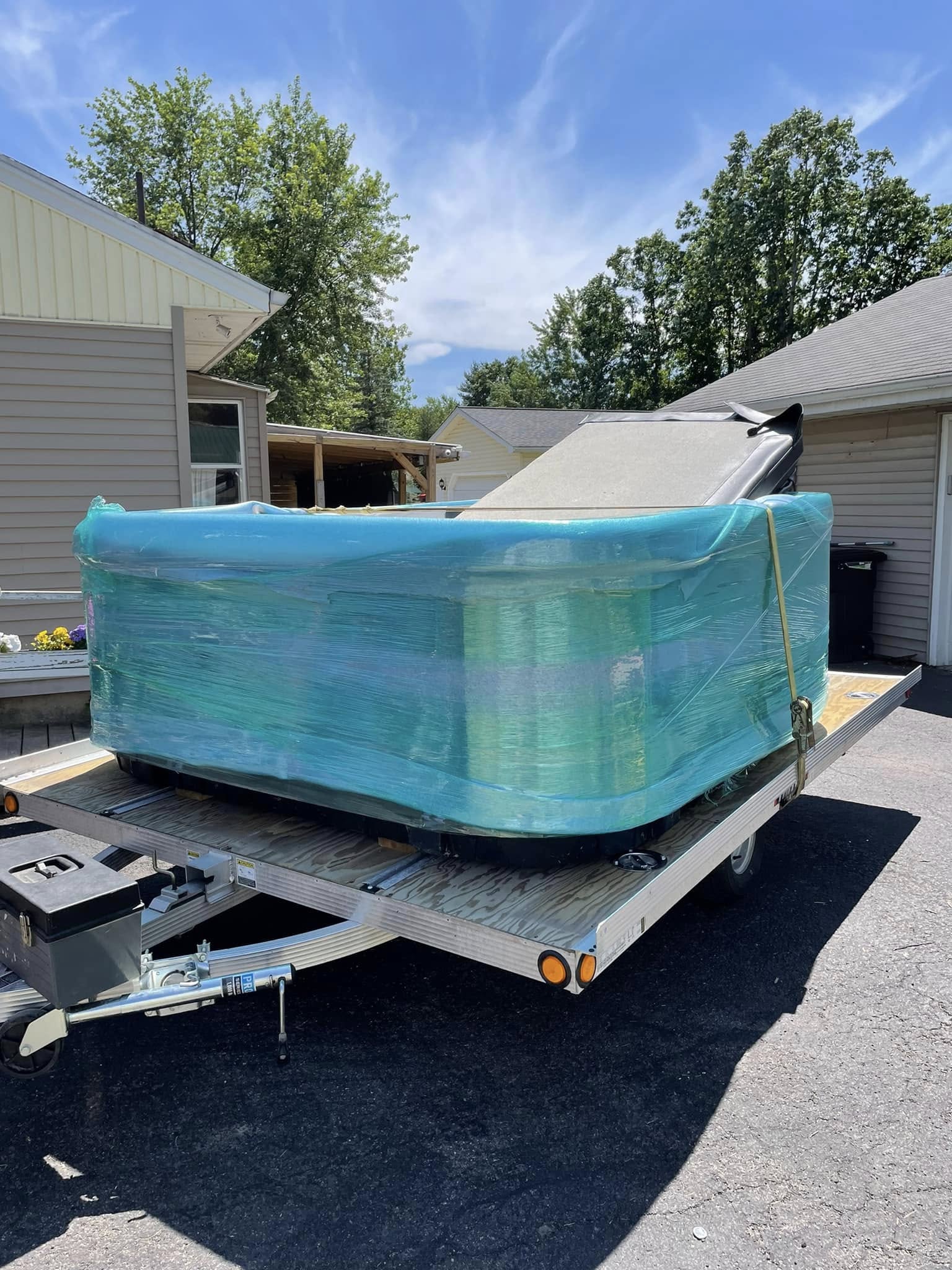 Hot tub wrapped and protected for safe transport